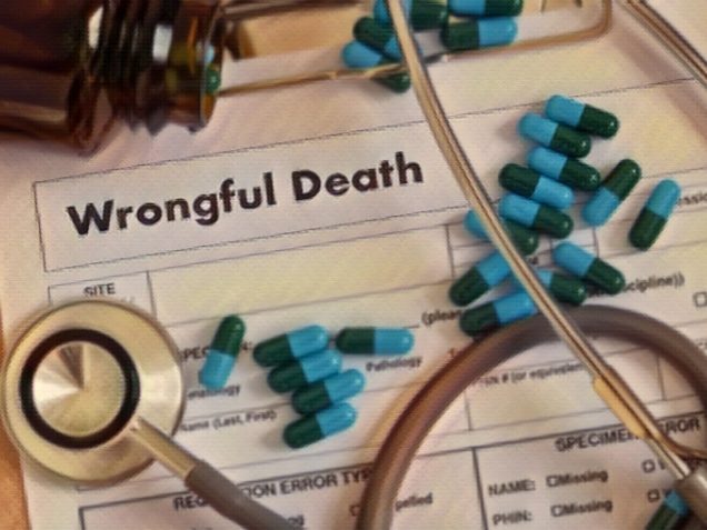 wrongful death printed on a paper with stethoscope and medicines