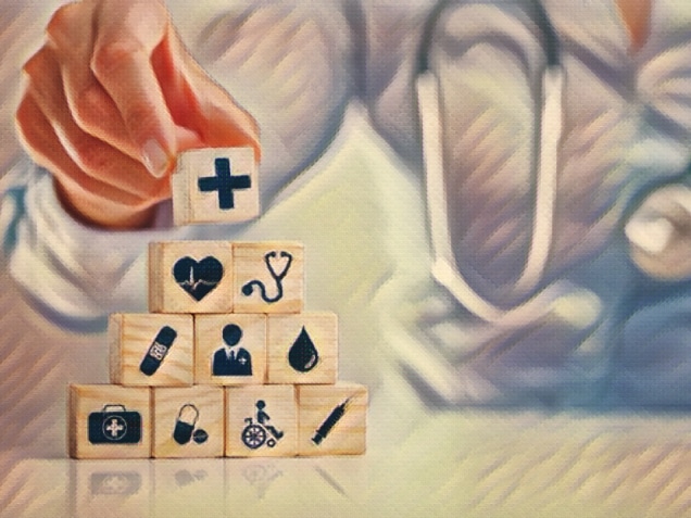 Hand arranging wood block with healthcare medical icon. Health insurance - concept.