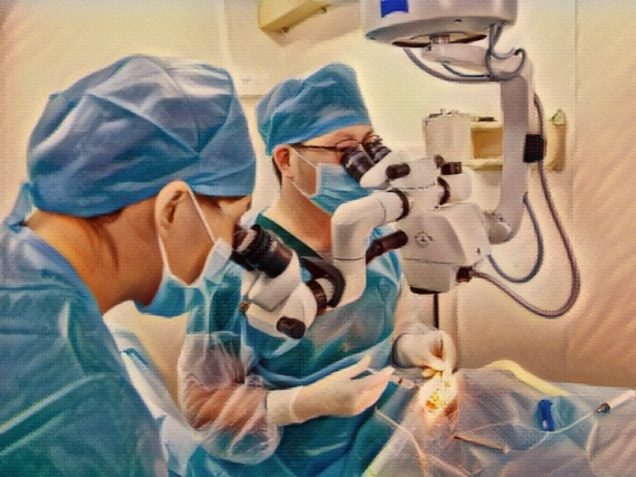 two doctors doing cataract surgery in operating room