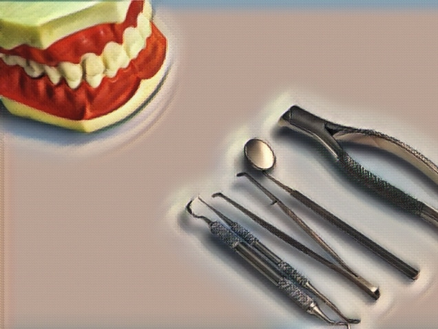 Teeth model with dental tools on blue background