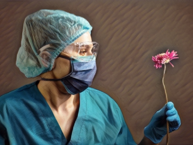Close-up studio portrait of a girl in a protective medical mask, glasses and a hat, a hirugic suit, in medical gloves, holds out a wilted gerbera flower