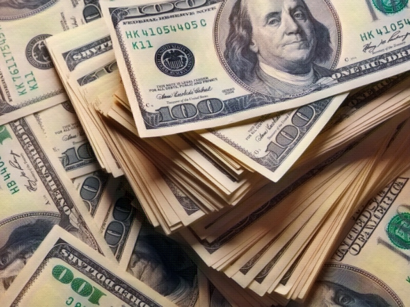 stack of one hundred dollars notes on dollars background. Supplemental security income in illinois