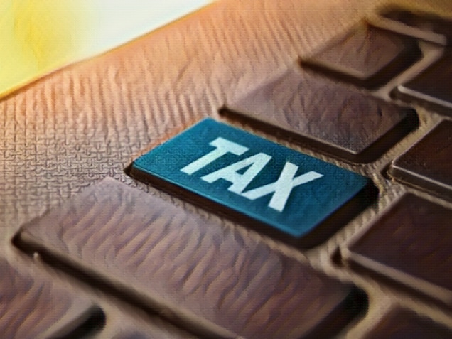 Tax keyword concept on computer keyboard technology background macro shot