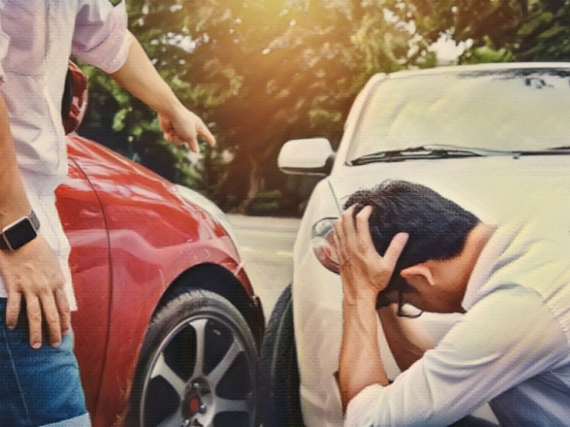 Two drivers man arguing after a car traffic accident collision
