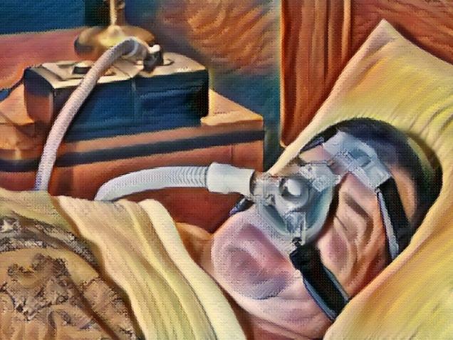 a senior man peacefully sleeps with a cpap mask on his face