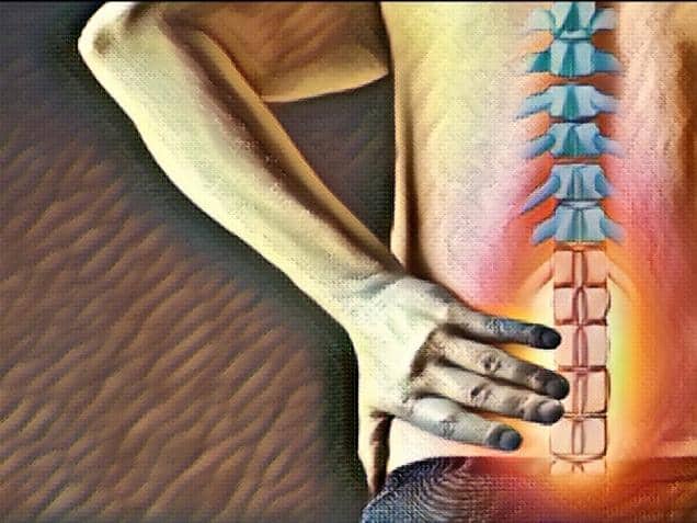 pain in the spine, man with backache on back background, intervertebral hernia or disc injury