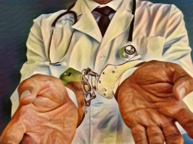 Doctor with handcuffs on his hands