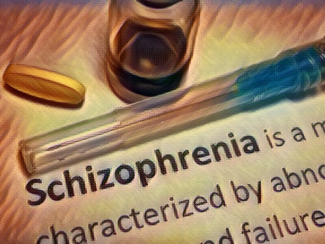 schizophrenia definition with medicines and syringe