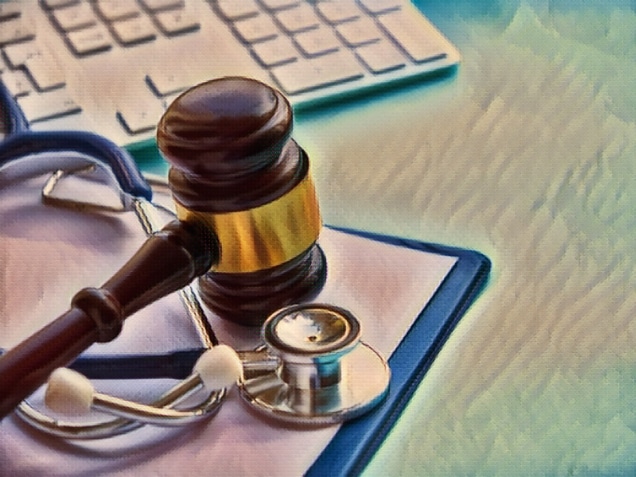 Gavel and stethoscope on top of a clipboard