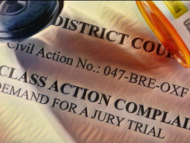 Class action complaint form with bottle of medicines on top