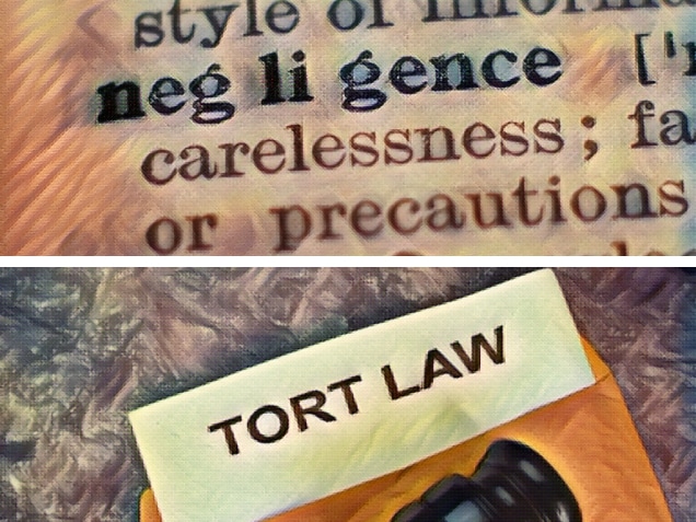 Tort Law text write on a paperwork and gavel isolated on office desk. Dictionary definition of word negligence, selective focus.
