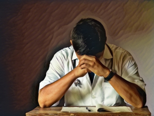 a doctor with hands on his head and looked depressed