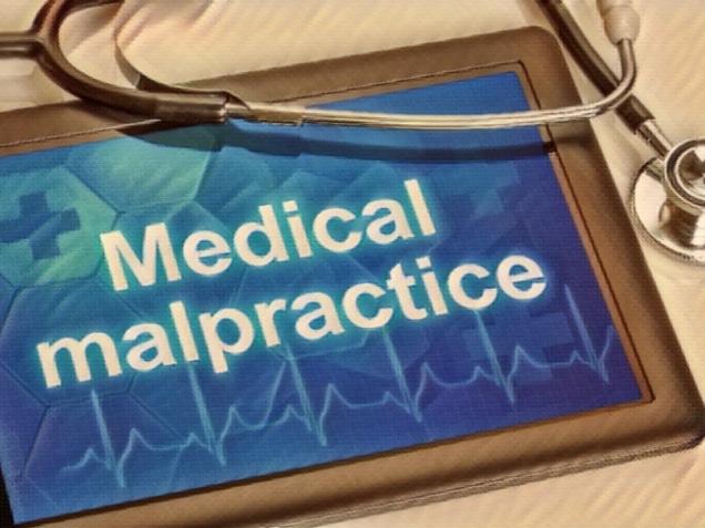 Tablet with the text Medical malpractice on the display