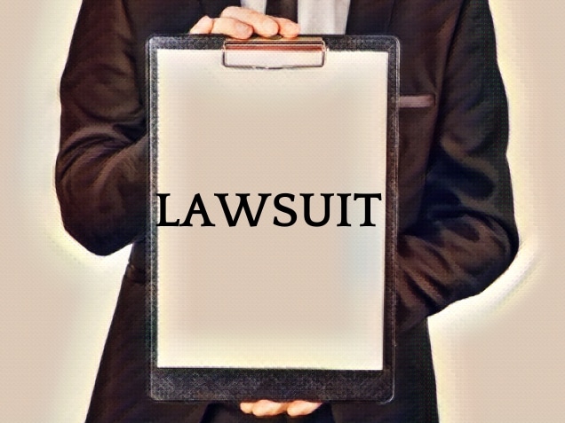 man holding a clipboard with lawsuit written on it