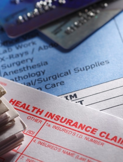 A health insurance claim form on a medical bill. Concept of Workplace Cancer