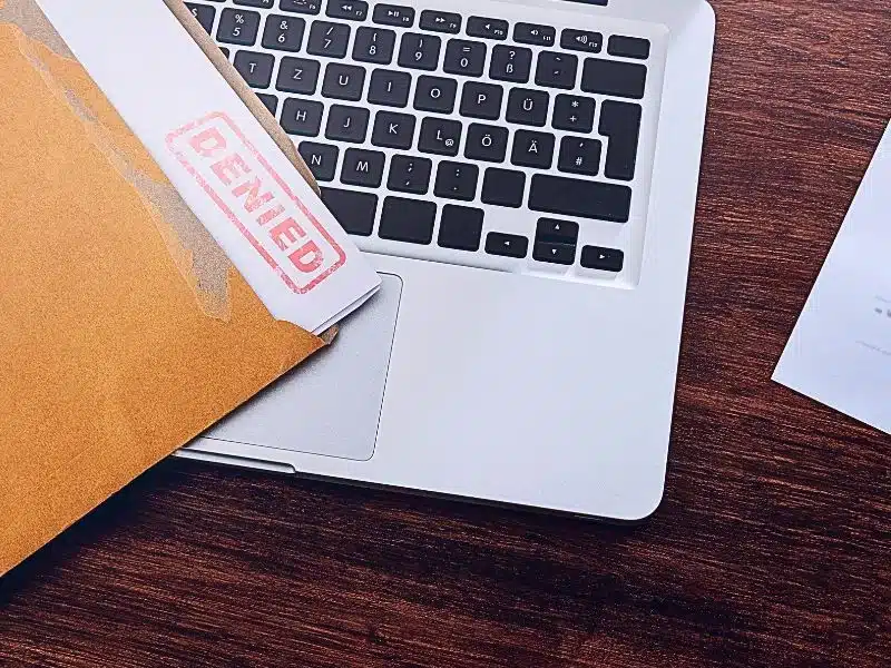 Document with denied stamp put on the wooden table. can an insurance company deny coverage