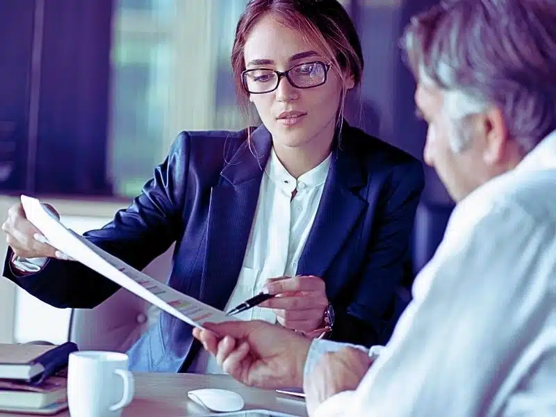 Lawyer advising client. How to File a Medical Malpractice Claim.