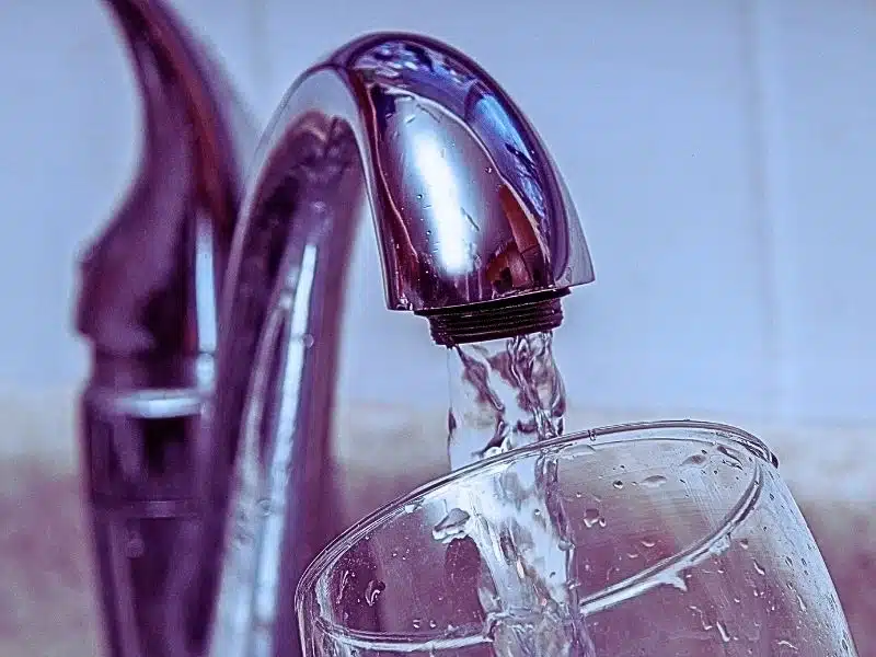 Glass at water tap and filling water. Who Is Eligible for the Camp Lejeune Lawsuit?