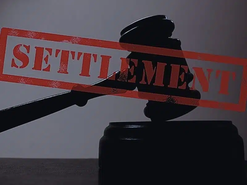 Judge legal gavel with settlement stamp. average settlement for hair relaxer lawsuit
