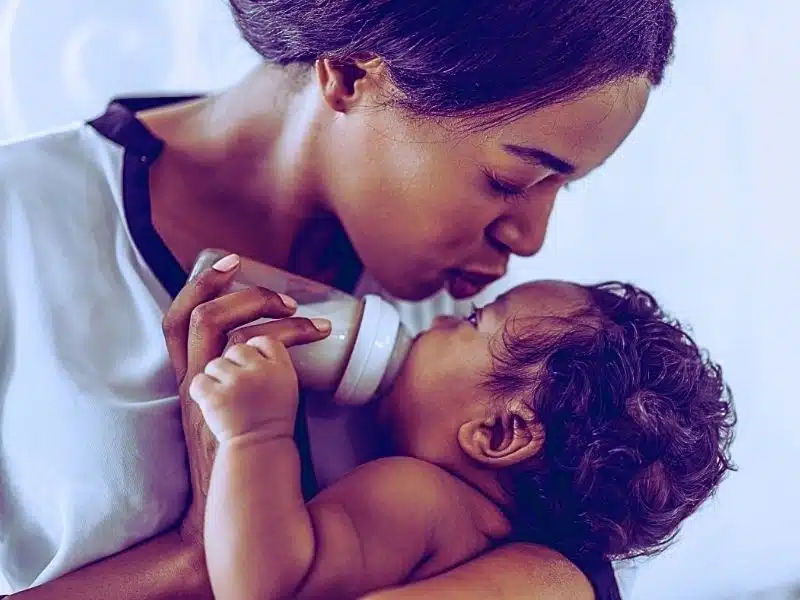Portrait of enjoy happy love family african american mother playing with adorable little baby. Is enfamil getting sued.